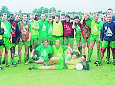 Players return from training july 2002